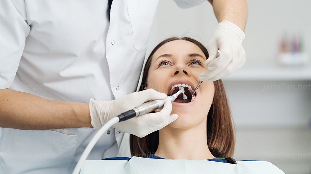 dentist doing scaling and brushing