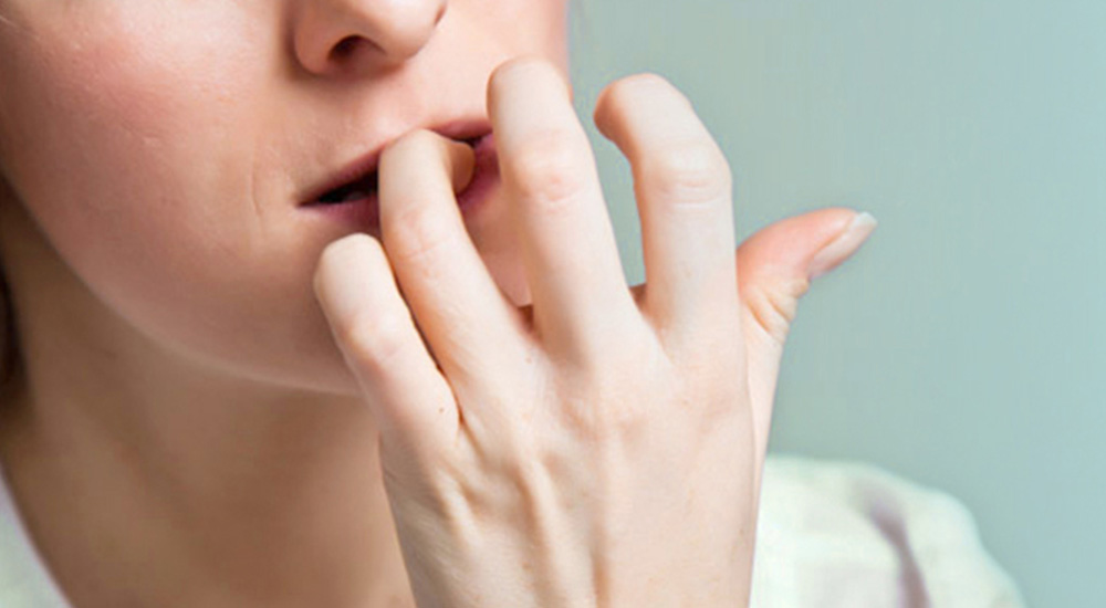 woman biting her nails