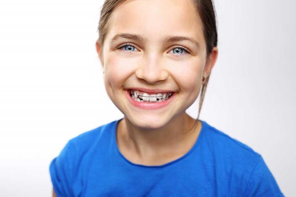 girl with removable orthodontics