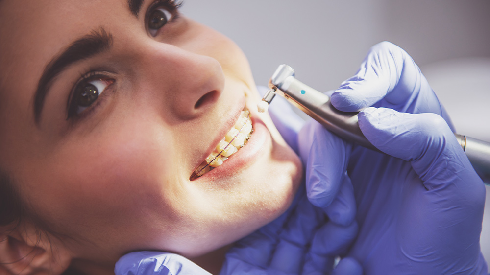 woman in dental office for quick orthodontic treatment