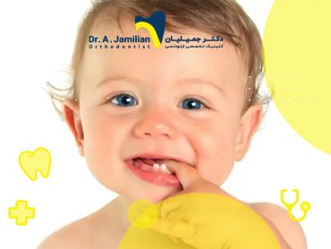 kid with blue eyes biting his finger